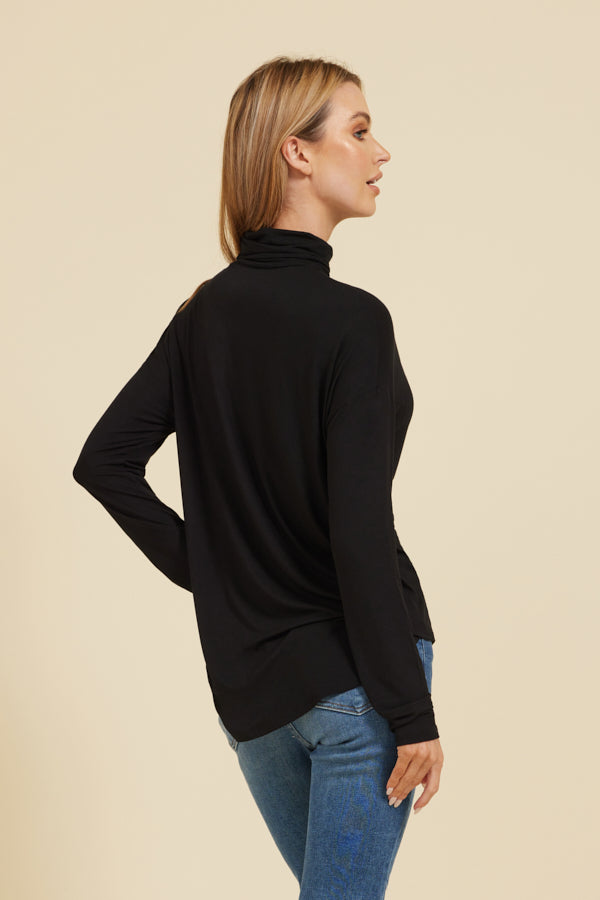 Majestic Soft Touch Semi-Relaxed Long Sleeve Drop Shoulder Turtleneck in Noir